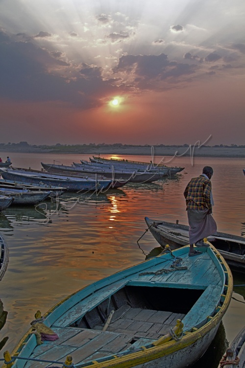 Sunrise over boats in Ganges in Varanasi