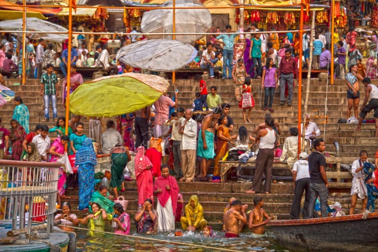 Devotees on Ghats of Varanasi taking a holy bath in Ganges