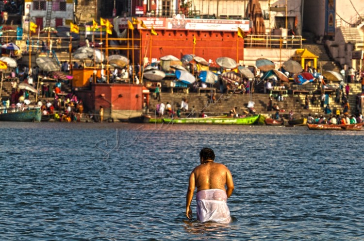 Pilgrim taking bath in Varanasi Ganges