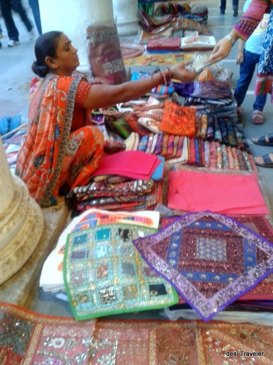 A lady vendor selling handicrafts in Connaught place New Delhi