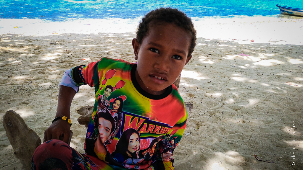 A kid wearing Bollywood shirt in Indonesia Arborek village
