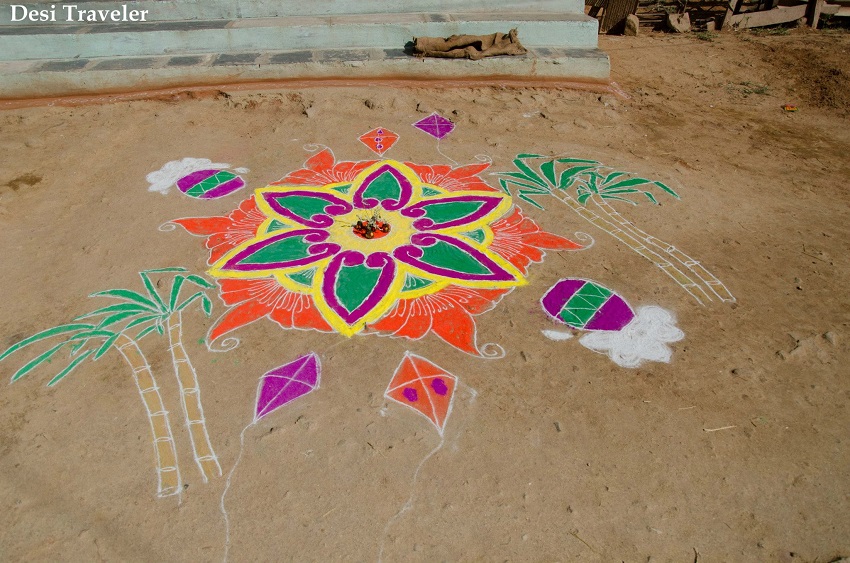 A traditional Rangoli design with sugarcane, kites coconuts flowers