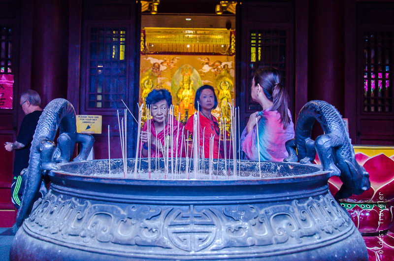 Devotees Praying at Chinatown Buddha Tooth Relic Temple