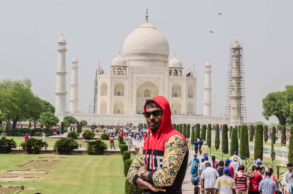 Boy posing in front of Taj Mahal Agra 