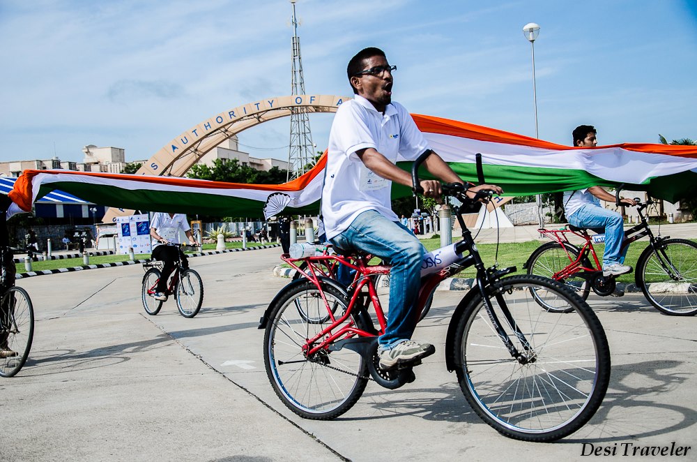 Cyclist carrying national flag of India
